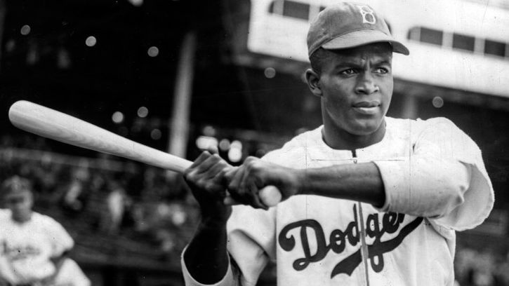 Which historic player stepped onto the field for the Brooklyn Dodgers in 1947, permanently breaking the color barrier in Major League Baseball?