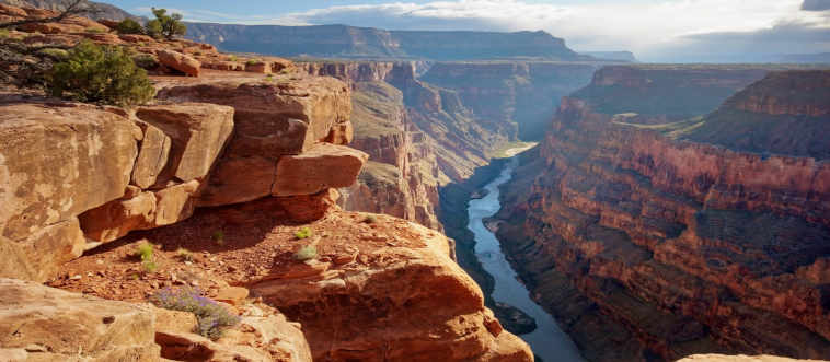 Which sun-drenched state holds the Grand Canyon, one of the globe's most spectacular natural chasms?