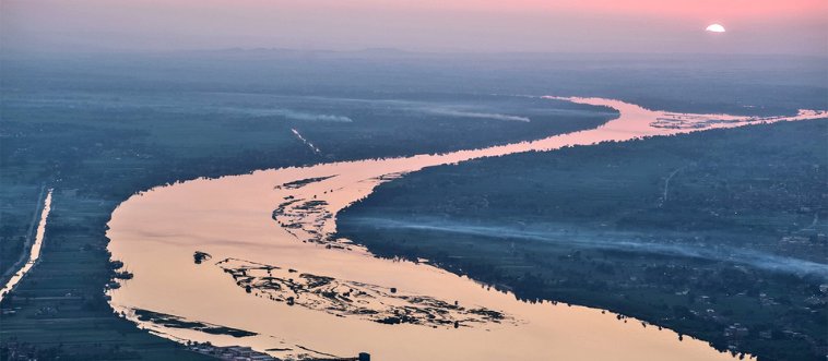 Can you spot the ancient, bustling metropolis that has the legendary Nile River winding right through its heart?