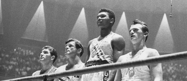 Let's kick things off with a golden moment: in what year did a young Muhammad Ali climb the Olympic podium to claim boxing gold?
